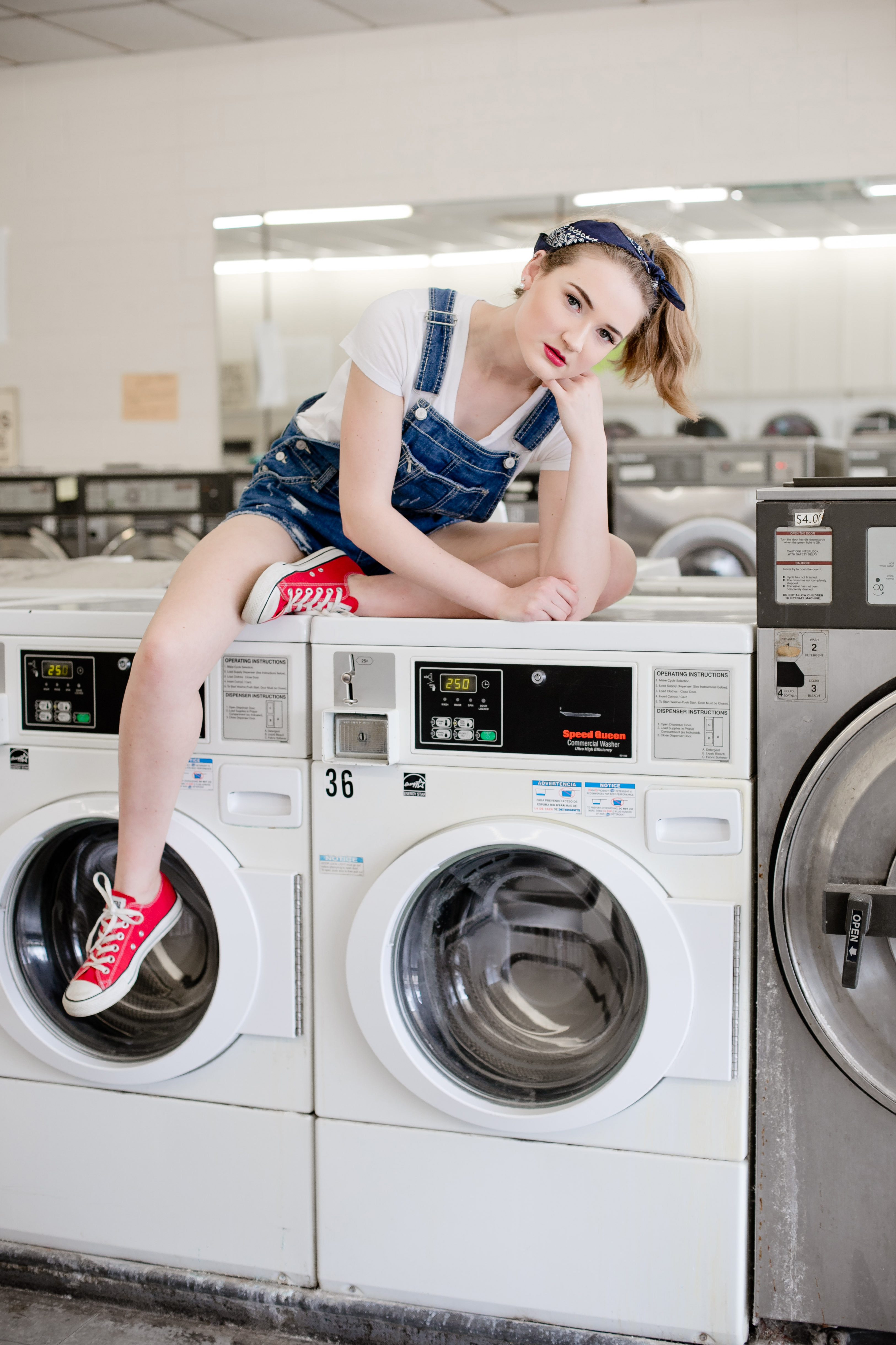 senior photos of girl in a laundromat taken by Carmilla Jane Photography of Columbus, OH