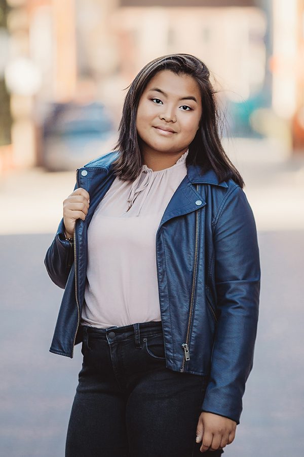 creative senior photoshoot of girl wearing a leather jacket near Columbus, OH