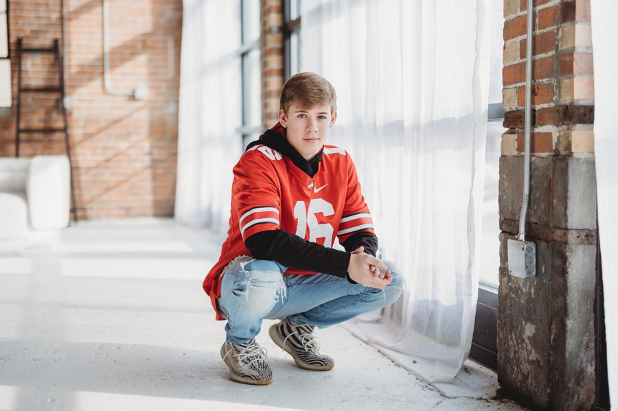 Grove City Senior Alex crouched down with hands together wearing Ohio State Buckeyes jersey